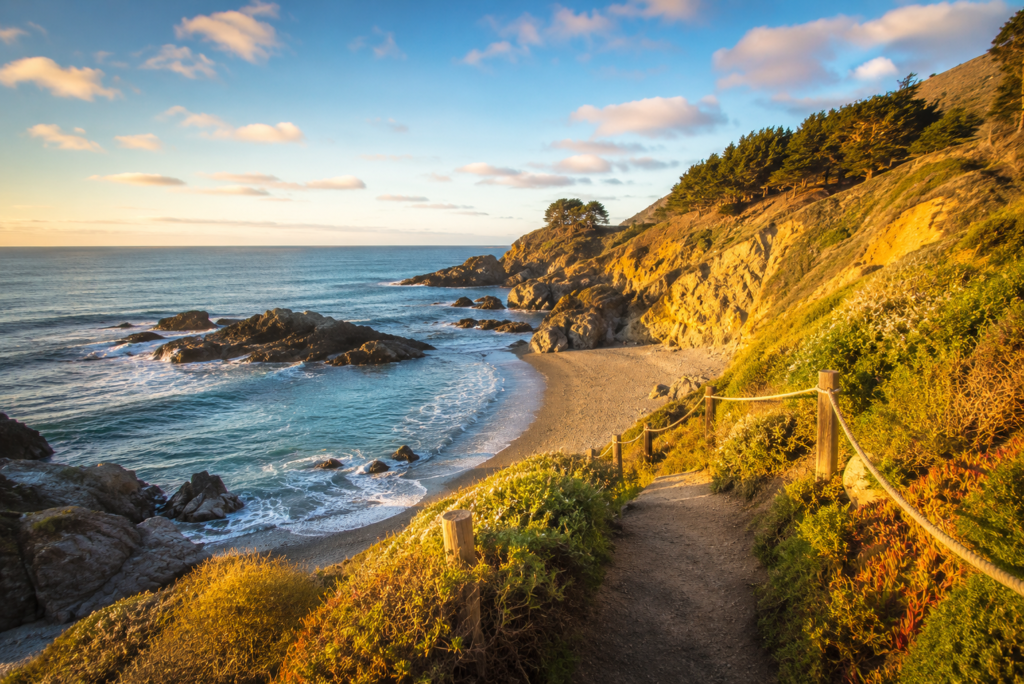 Coastal trail leading to a sea glass-covered cove along the Mendocino Coast